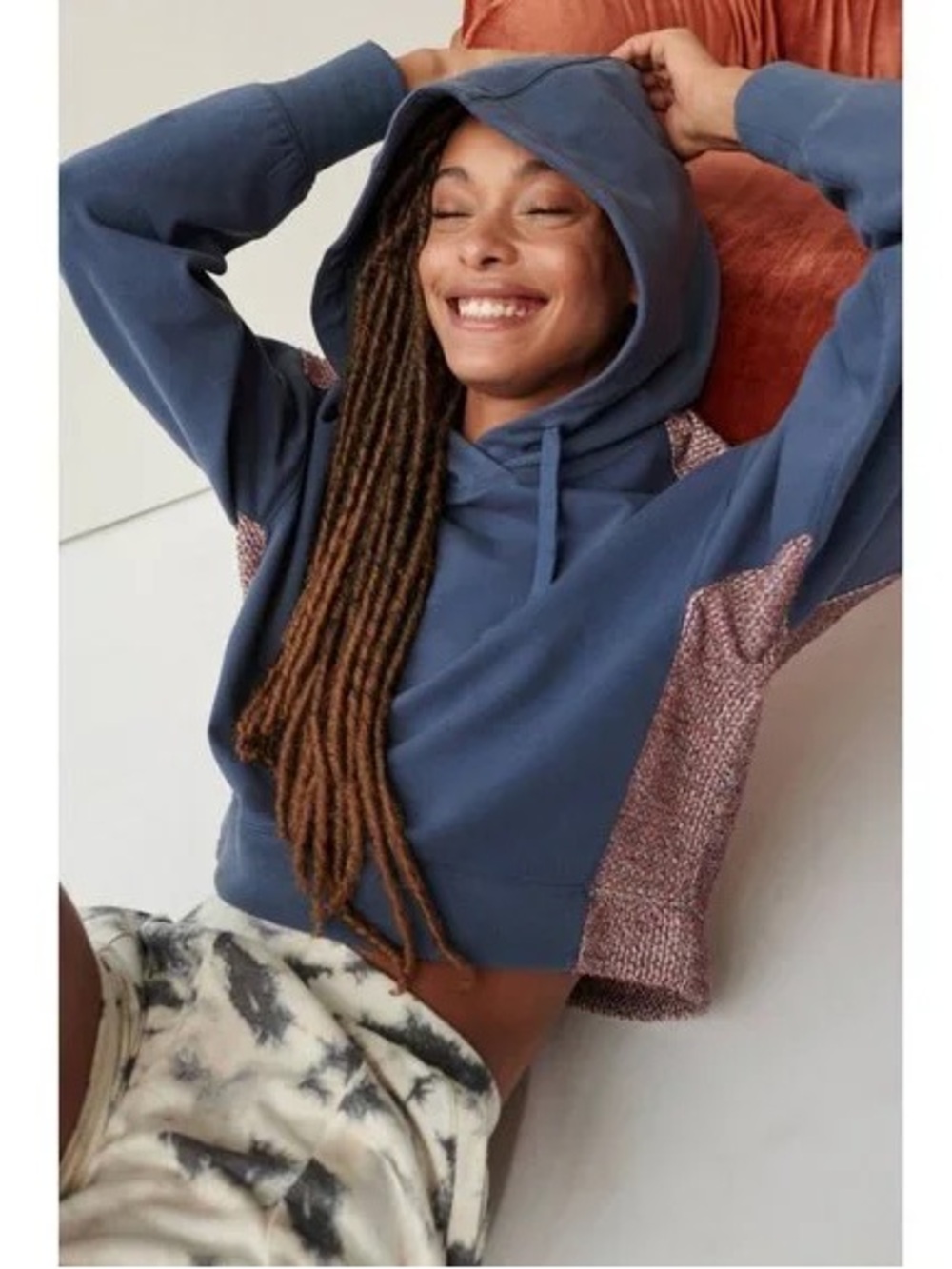 Anthropologie Blue Cropped Hoodie with multicolored side panels.